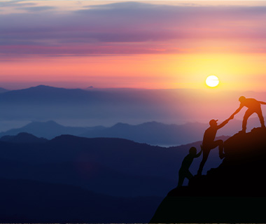 silhouettes of three climbers helping each other ascend a mountain at sunset with a breathtaking landscape and six motivational themes